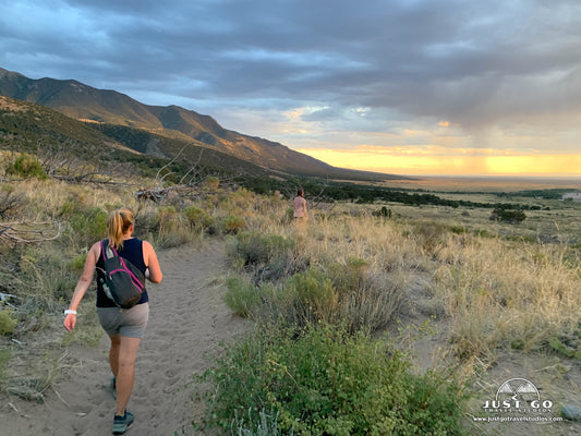 hiking in great sand dunes national park at sunset