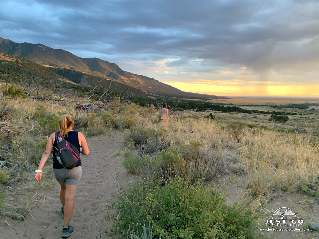 hiking in great sand dunes national park at sunset
