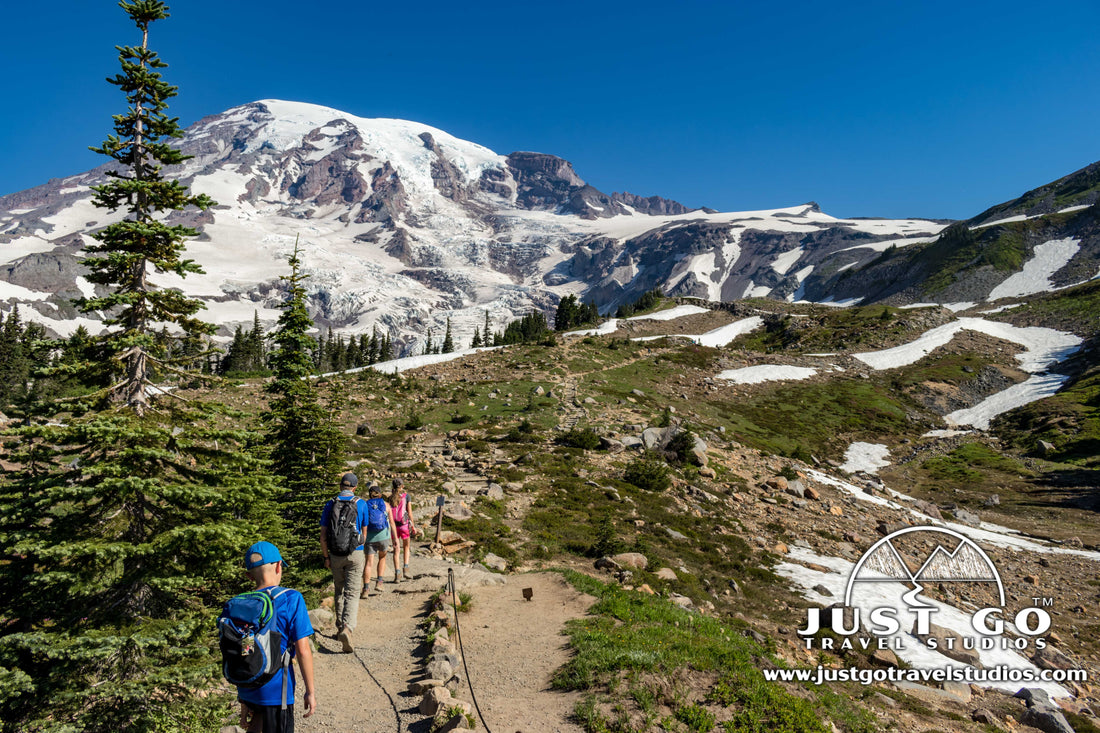 hikers with Mount Rainier in the background in Mount Rainier National Park