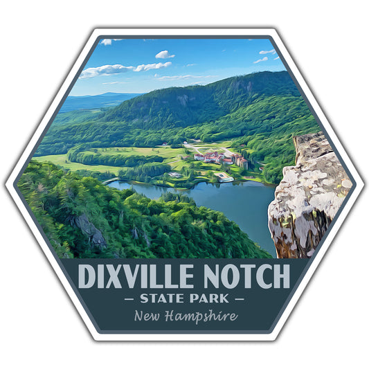 A hexagonal scenic sticker or print featuring an aerial view of Dixville Notch State Park in New Hampshire, with green mountains, a lake, fields, and a rocky cliff. Text at the bottom reads “DIXVILLE NOTCH • STATE PARK • New Hampshire.