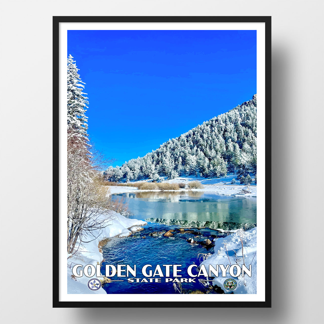 Framed poster of a snowy landscape with a lake and mountains, featuring 'Golden Gate Canyon State Park'.
