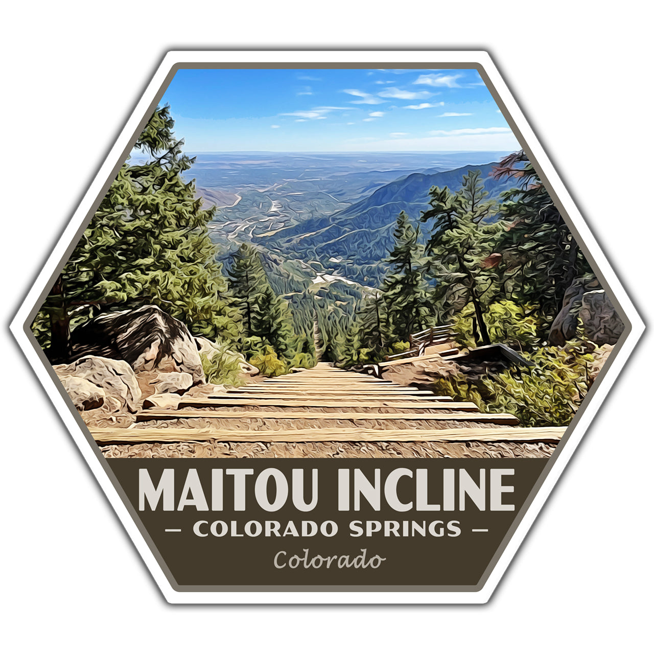 A hexagonal sticker or patch featuring a scenic photograph of the Maitou Incline in Colorado Springs, Colorado, with a wooden stairway leading into a mountain valley surrounded by pine trees under a blue sky. The bottom section is dark brown with white text reading 'MAITOU INCLINE', 'COLORADO SPRINGS', and 'Colorado'.