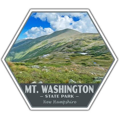 A hexagonal sticker or patch featuring a scenic photograph of Mt. Washington State Park, New Hampshire, with a gray banner at the bottom reading 'MT.