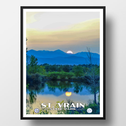 Framed poster of a sunset over mountains with a lake, featuring 'St. Vrain State Park'.